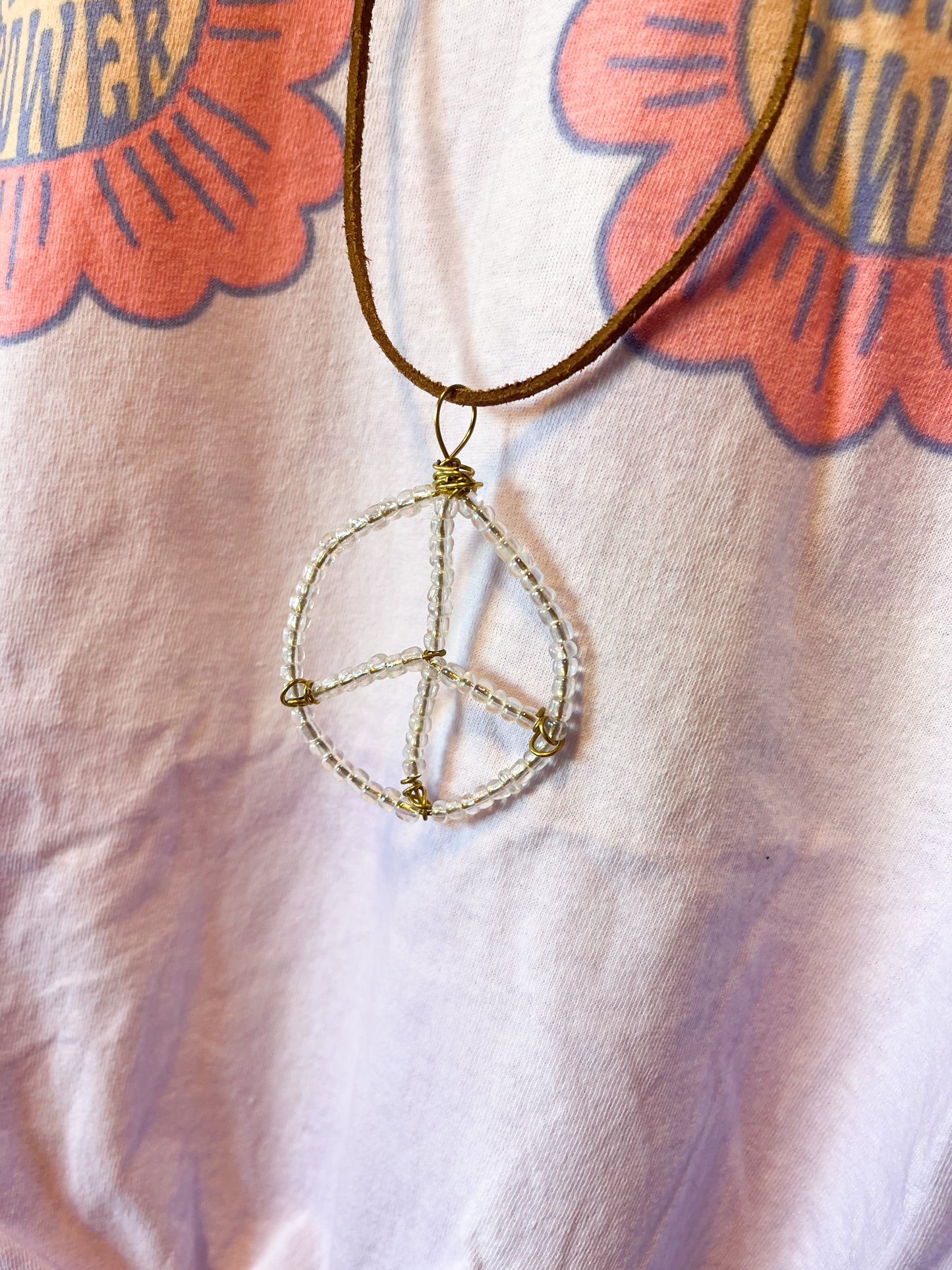 Clear metallic beaded wire peace sign necklace