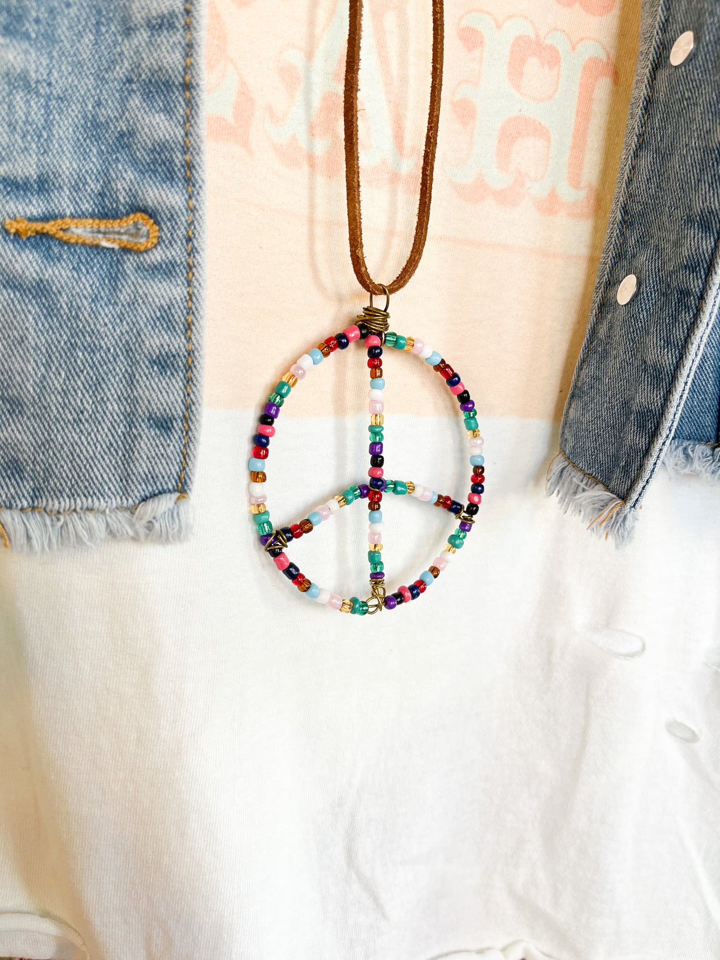 Multi colored wire and bead peace sign statement necklace