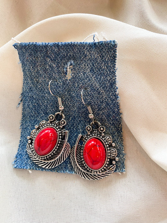 red stone and feather earrings