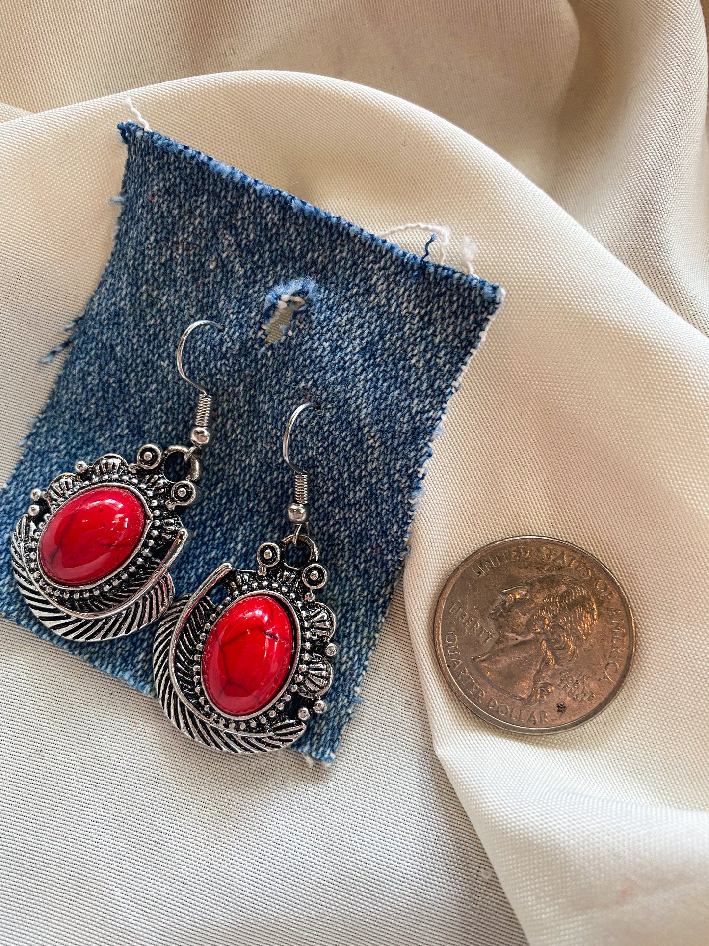 red stone and feather earrings