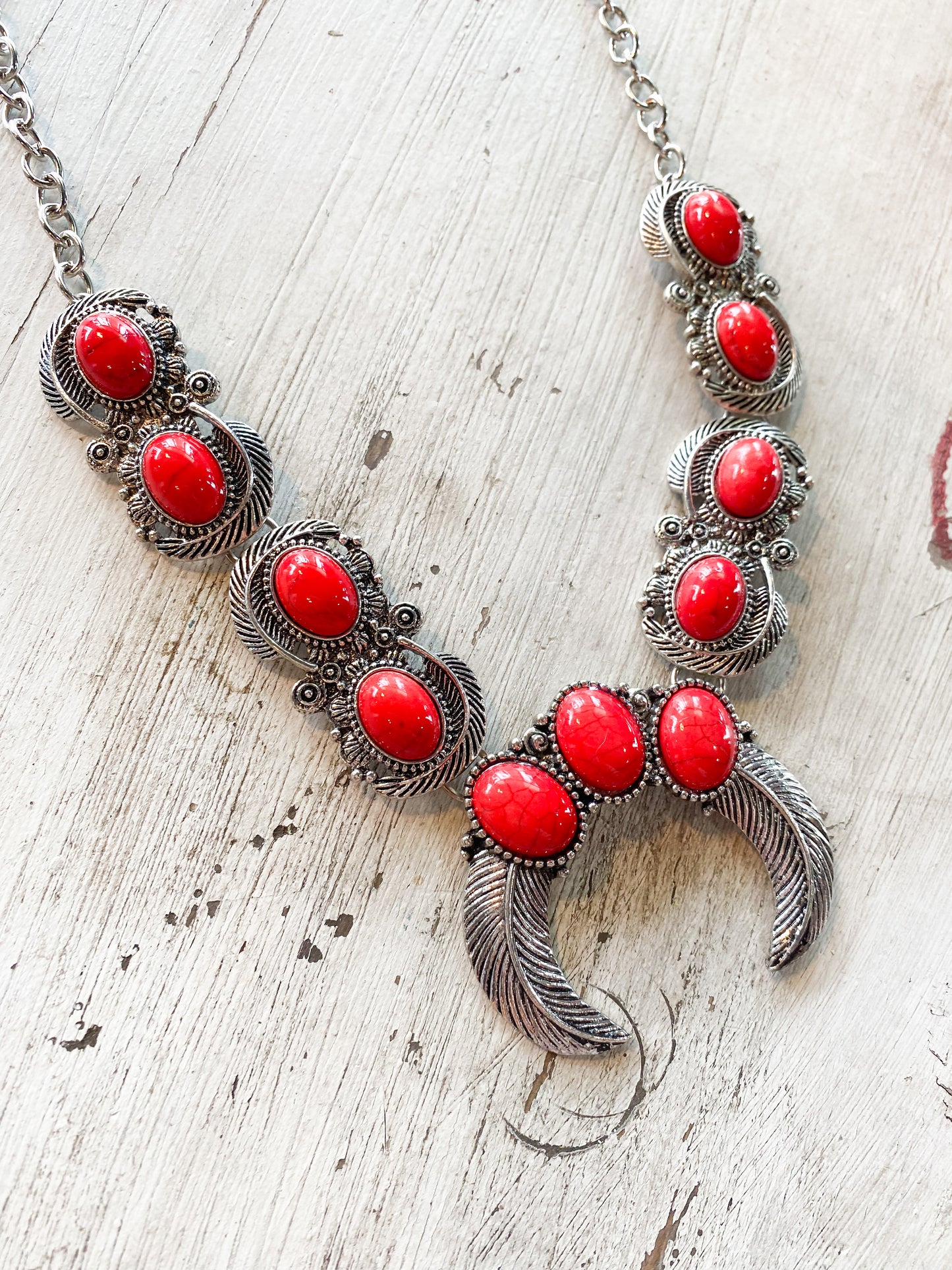 Red stone and feather layered necklace